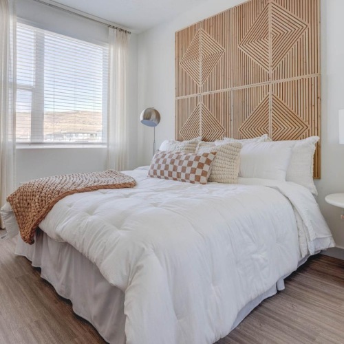 a bedroom with a bed and a dresser