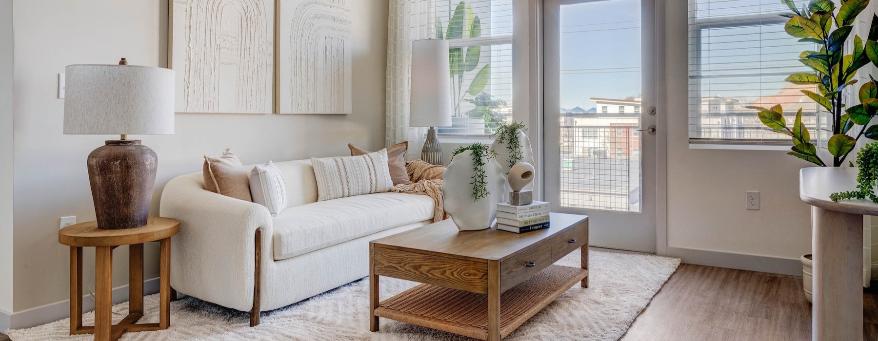 a living room with a white couch and a coffee table