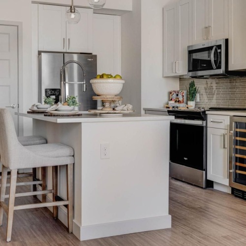 a kitchen with white cabinets