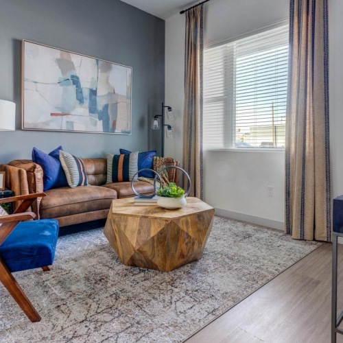 a living room with a couch and a table