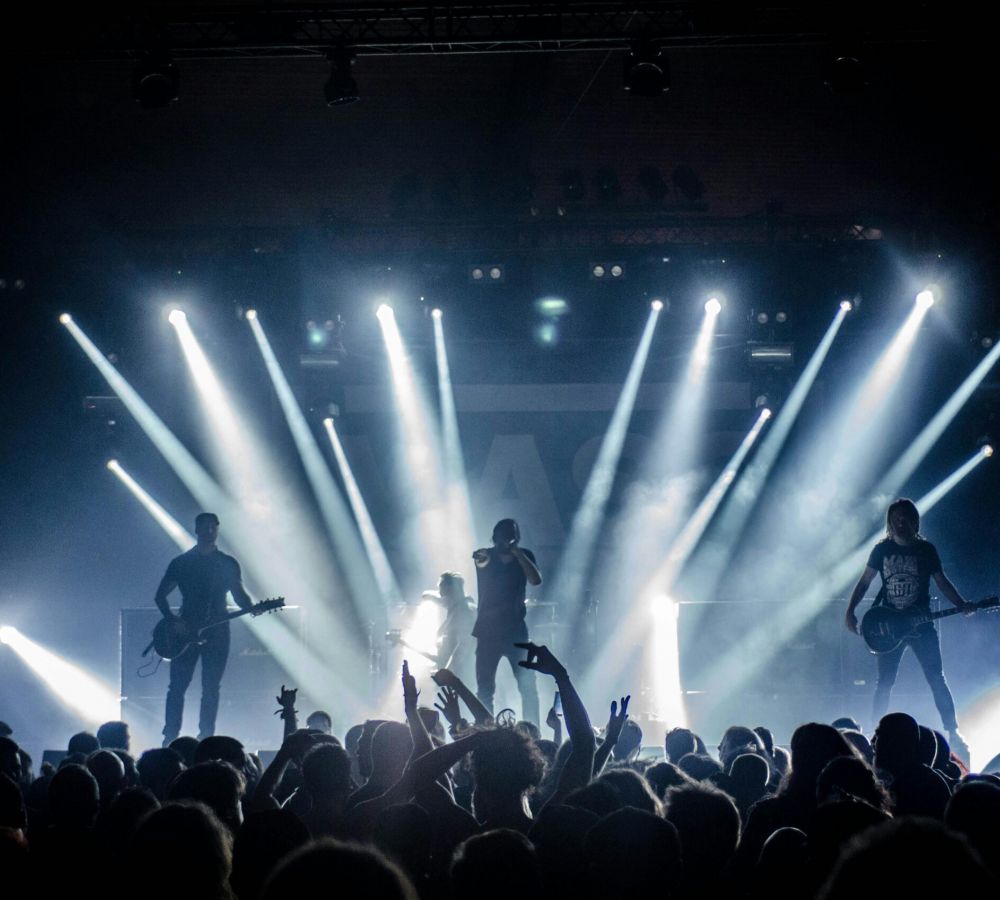 Rock band performing on a stage in a theater