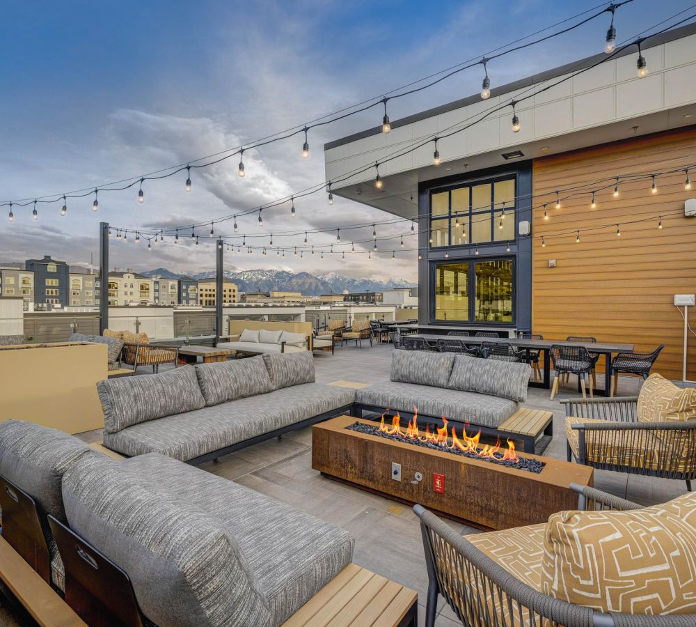 Alta Stone at the Gateway outdoor patio with lounge seating and fireplace